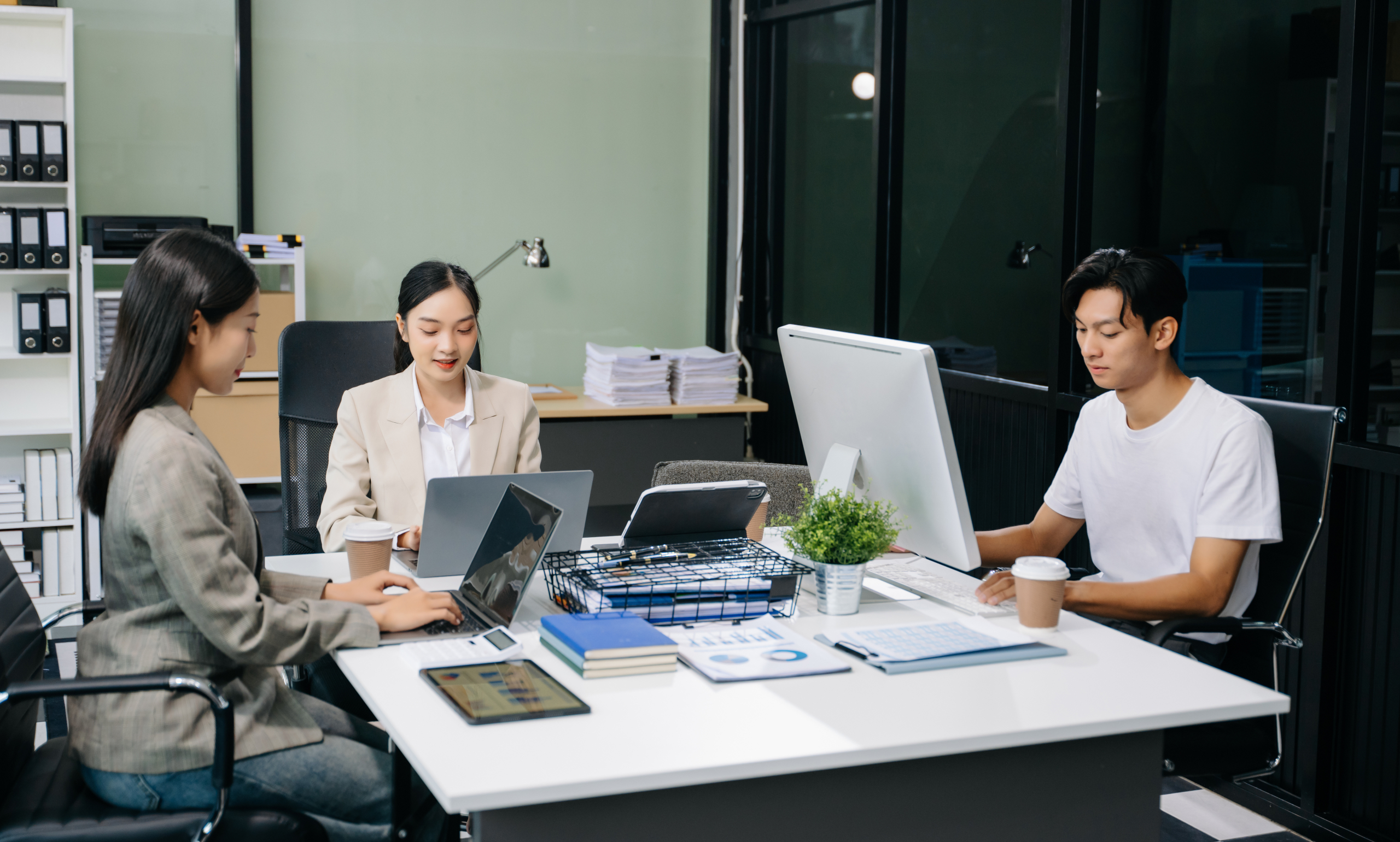 Business team discuss at meeting room. working together with lap